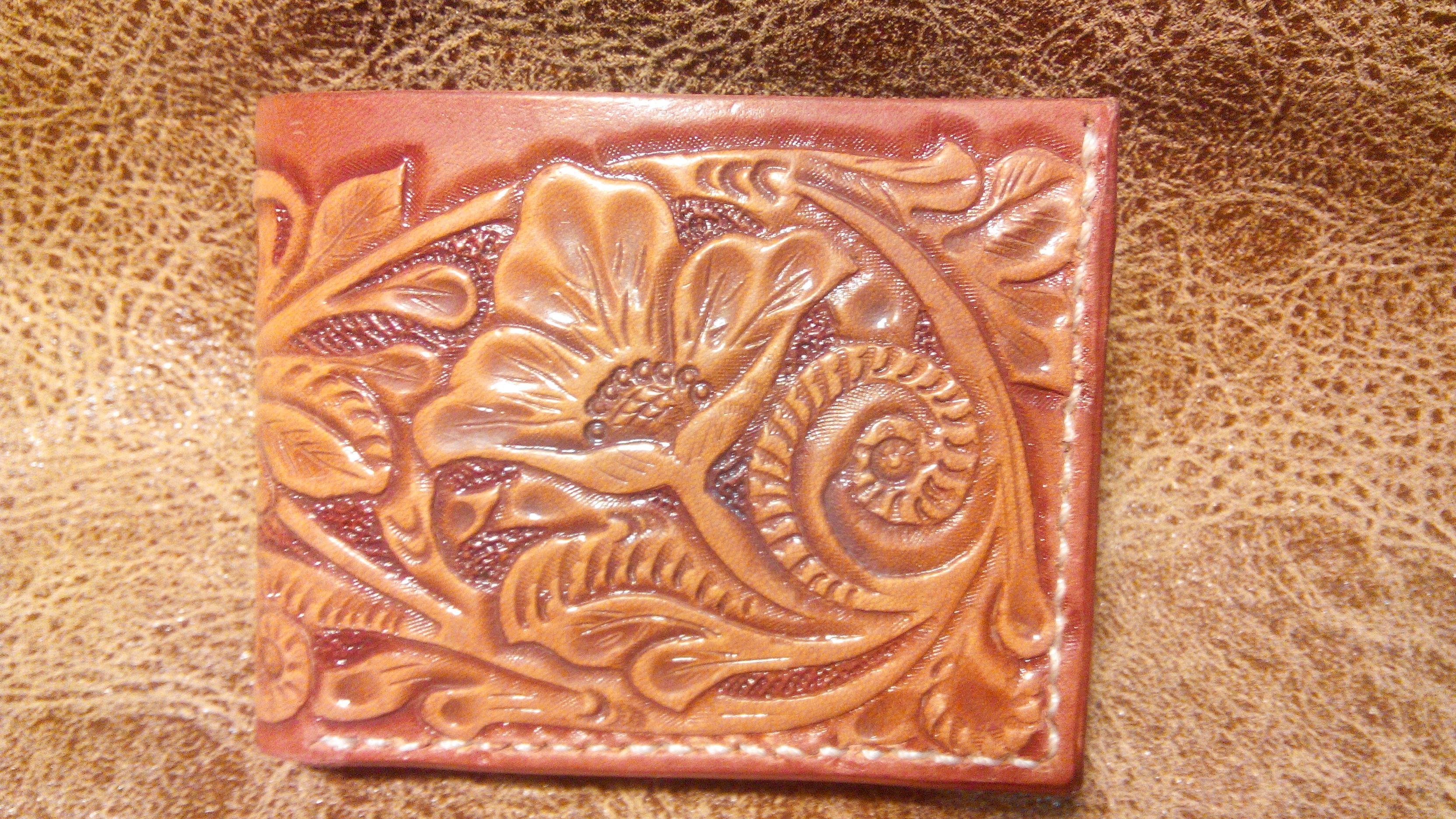 кошелек с тиснением шеридан. тиснение работы. тиснение кожи растительного дубления. тиснение работы. тиснение работы.