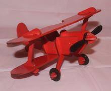 Игрушка красный аэроплан