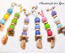 Грызунки-погремушки из можжевеловых бусин  в ассортименте