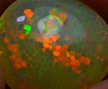 Безумно яркий и динамичный эфиопский опал, 14,23 карата.