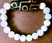 Браслет из оникса с Тибетской бусиной Дзи 9 глаз