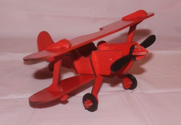 Игрушка красный аэроплан