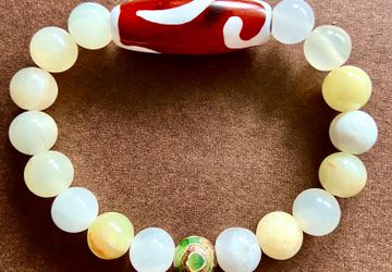 Браслет из оникса с тибетскими бусинами Дзи Золотой ключ и 3 глаза