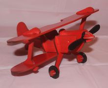 Игрушка красный аэроплан