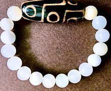 Браслет из оникса с Тибетской бусиной Дзи 9 глаз