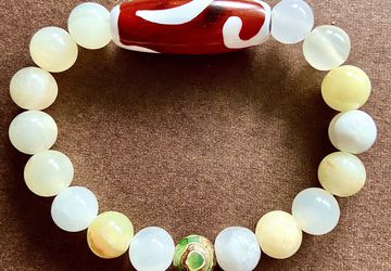 Браслет из оникса с тибетскими бусинами Дзи Золотой ключ и 3 глаза