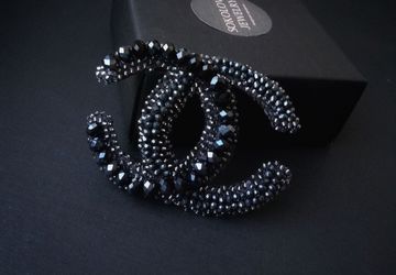 Black brooch with zircons