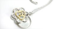 AXS300-11: Gold and Silver Flower Pendant & Magnifier Reading Glass Necklace
