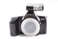 Minolta Maxxum 3000i slr camera body with Minolta flash