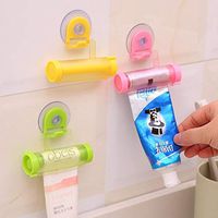 HuntGold Plastic Toothpaste Tube Squeezer Rot/ating Paste Dispenser Sucker Hanging Holder Random Color