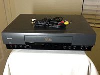 RCA VR327 VCR Video Cassette Recorder 4-Head Hi-Fi Stereo VHS Player. On-Screen Programming. Works Great. Comes with A/V cable for TV connection