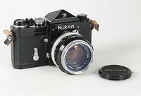 BLACK NIKON F BODY WITH PRISM FINDER NIKKOR 50MM F 1.4 LENS SER# 6473884