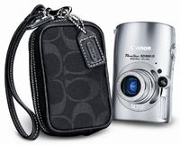 Canon Powershot SD990IS 14.7MP Digital Camera with 3.7x Optical Image Stabilized Zoom Coach Kit (Silver)