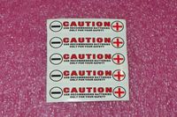 Battery tray polarity stickers