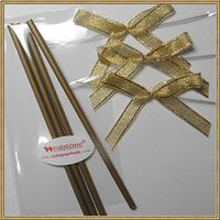 Cake pop sticks + clear bags + colorful ribbon bows (gold)