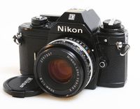 NIKON EM 35MM SLR CAMERA W/50MM F/1.8 LENS