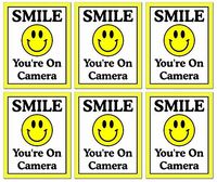 6 Pack of Large (4" Wide x 5" Tall)"Smile You're On Camera" Video Surveillance Security Decals Door Window Wall Vinyl Stickers for Indoor/Outdoor Use; Adhesive on Back