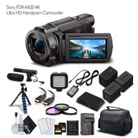 Sony FDR-AX33 4K Ultra HD Handycam Camcorder. 2 Extra Batteries + Case + 2 64GB Memory Cards + Tripod + Light and Microphone - Professional Bundle