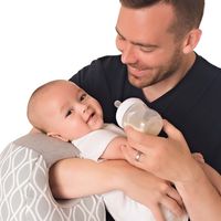 Itzy Ritzy Infant Nursing Pillow - Milk Boss Breastfeeding and Bottle Feeding Pillow and Positioner - Rotates Around Arm to Offer a Custom Fit and Relieve Arm Strain, Platinum Helix