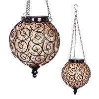 Exhart Solar Hanging Lantern, Handblown Amber Glass - Round Hanging Lantern Light w/ 12 LED Firefly String Lights, Metal & Glass Lantern Decorative Orb for Outdoor Décor (7in l x 7in w x 20in h)
